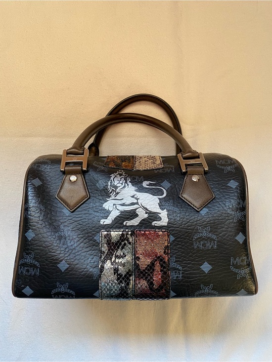 MCM Other - MCM Black Leather Boston Bag with Lion Motif and Mixed Snake-Print Accents